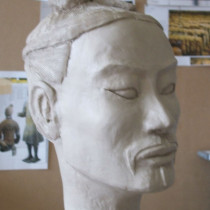 13 head models sculpted in clay, casted in plaster, assembled according to their position in the army distinguished by the headgears.