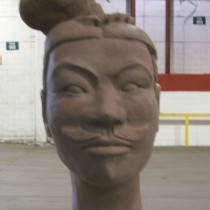 13 head models sculpted in clay, casted in plaster, assembled according to their position in the army distinguished by the headgears.