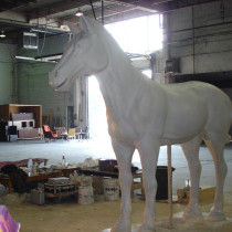 Here the finished sculpture of the larger size horse ready to be molded. This type of horse was accompanying Jet Lee's sculpture on the Chariot. Four (4) of this type were made. Sculptors: Lucie Fournier, Chantal Deshaies and Linda Bicari. Sculpture in styro, finition in plaster, molded and casted in plaster